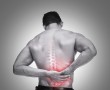 Young man suffering from back pain