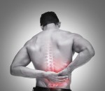 Young man suffering from back pain